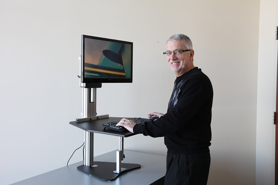SITTING IS KILLING US - HOW A STAND-UP DESK HELPS YOUR HEALTH